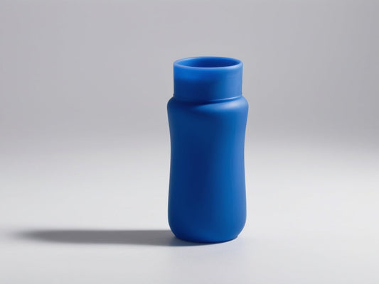 Plain blue food-grade silicone bottle accessory on a neutral studio background
