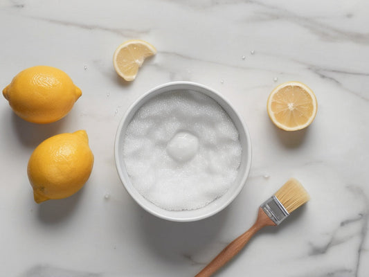 Baking soda, lemons and a cleaning brush flat-lay for cleaning a straw lid